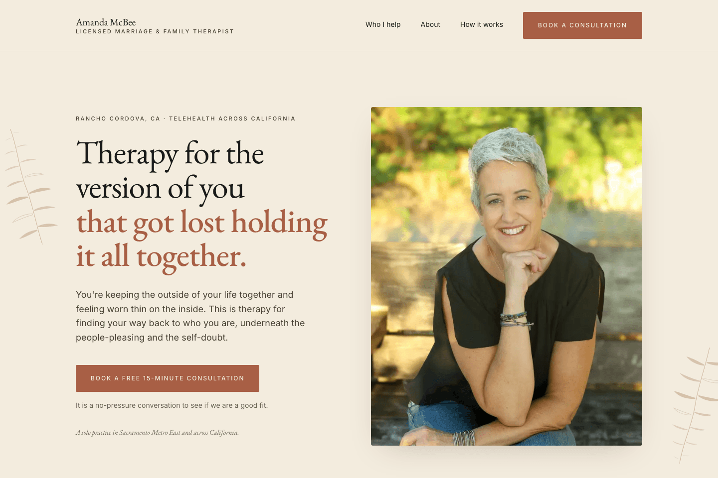 Homepage of Amanda McBee, LMFT, with a warm cream and rust design, identity-led headline, consultation button, and portrait